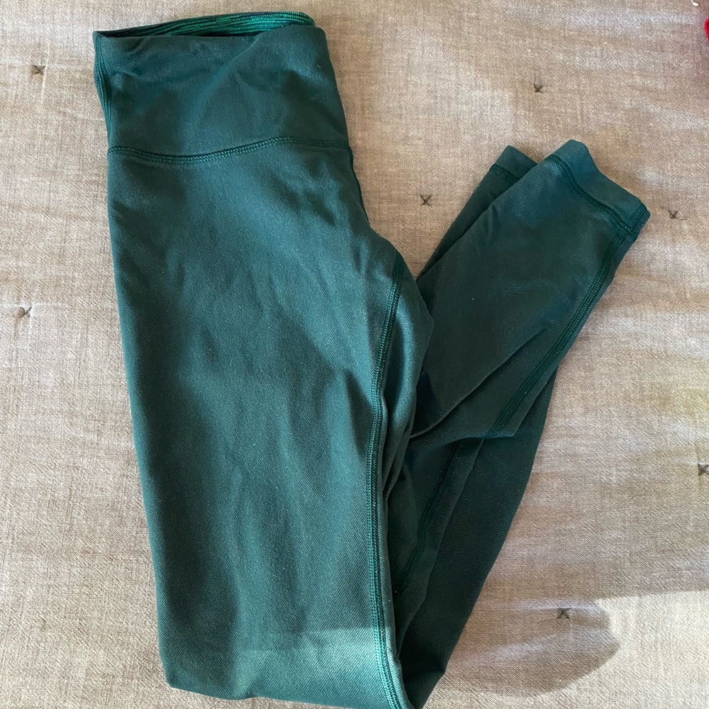 Green lululemon pants. Tag cut off but they are size 4